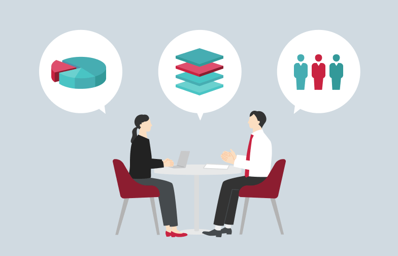 Two people sit across a table discussing data; speech bubbles show a pie chart, stacked layers, and three figures representing a team.